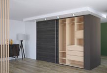 Maximize Style and Space with Custom Reach-In Closets by Amaya Luxury custom reach-in closet with adjustable shelving and smart lighting.