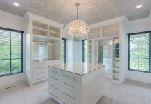 Redefine Luxury with a Custom Walk-In Closet by Amaya Elegant custom walk-in closet with smart lighting and premium storage solutions.