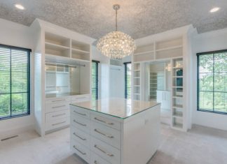 Redefine Luxury with a Custom Walk-In Closet by Amaya Elegant custom walk-in closet with smart lighting and premium storage solutions.