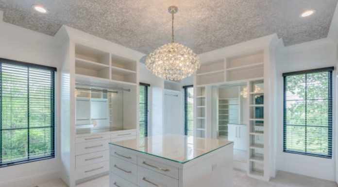 Redefine Luxury with a Custom Walk-In Closet by Amaya Elegant custom walk-in closet with smart lighting and premium storage solutions.