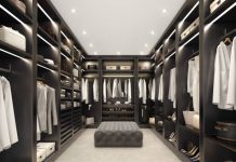 Illuminate Your Style: Amaya’s Custom Closet Lighting for Elegance and Comfort Custom walk-in closet with elegant lighting on shelves, drawers, and hanging space.